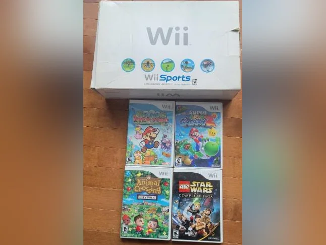 Console Nintendo Wii Sports avec une manette supplémentaire et jeux
