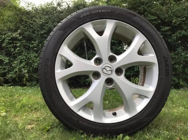 4x Mazda 17” mag 5x114.3 + 205/50R17 All season performance tire